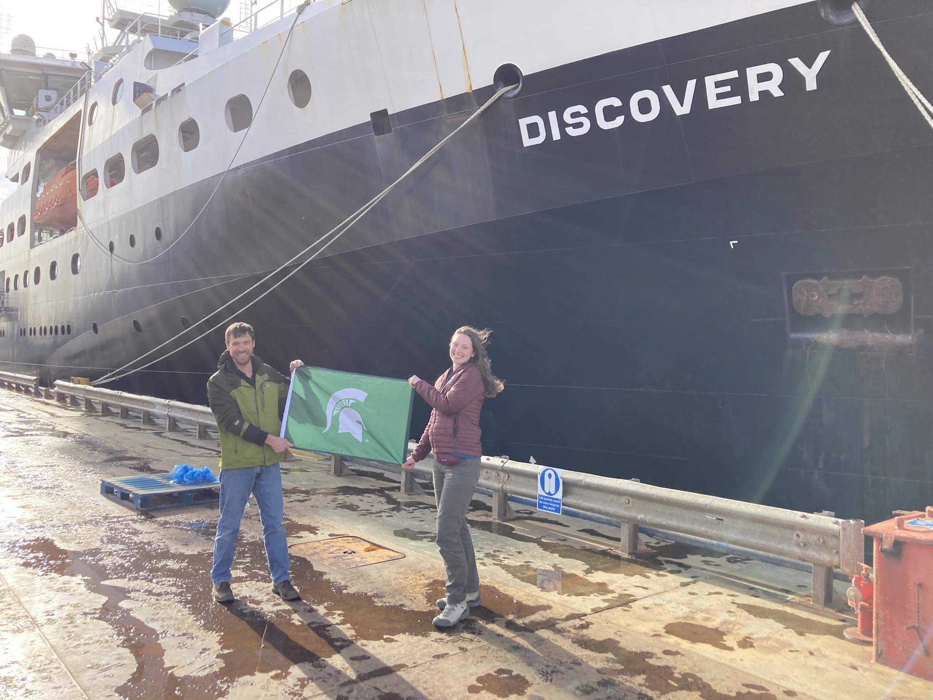 Dalton Hardisty and Kirsten Fentzke in front of HMS Discovery