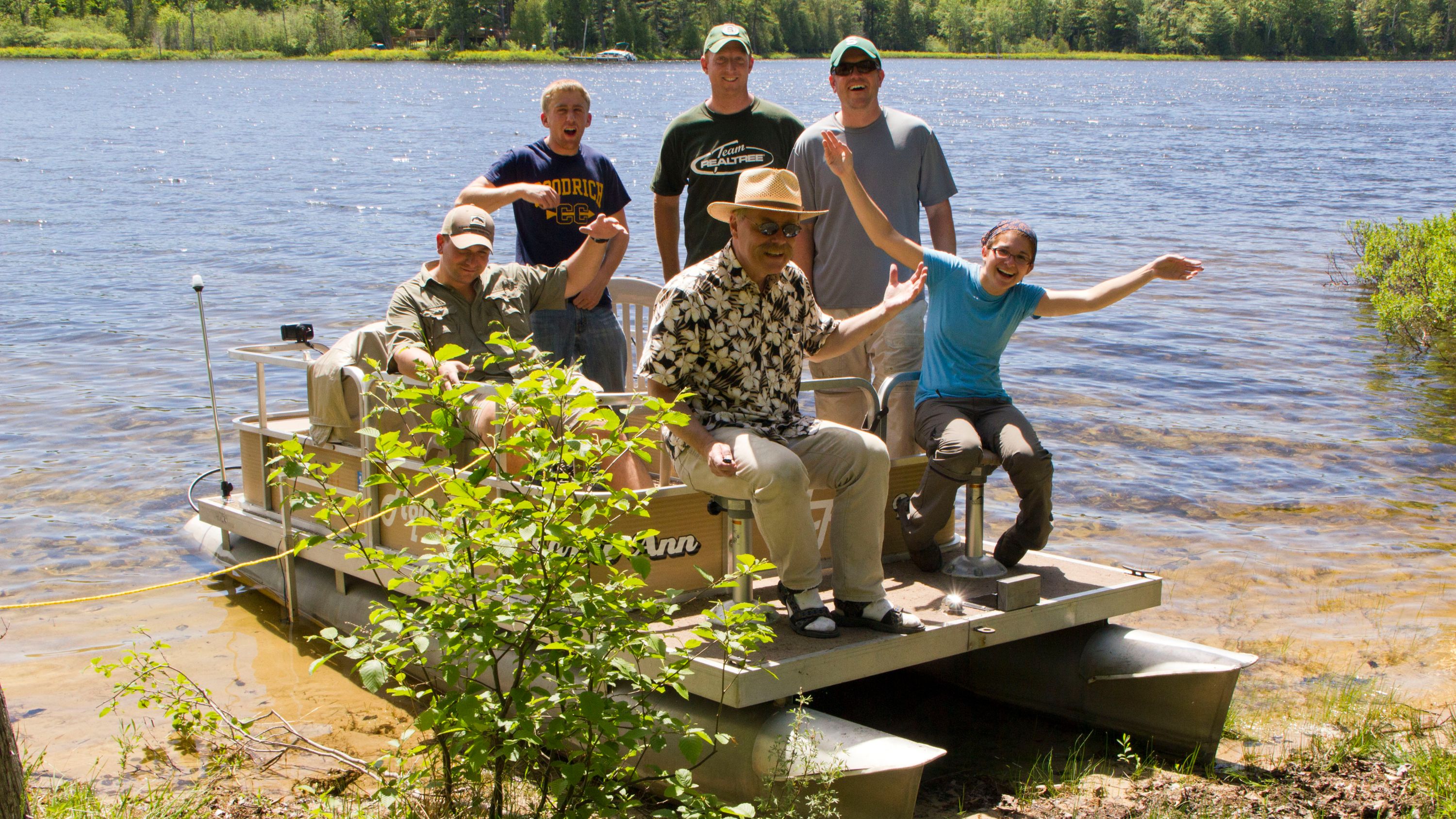 posing with sampling crew on boat in Lake Geneserath 