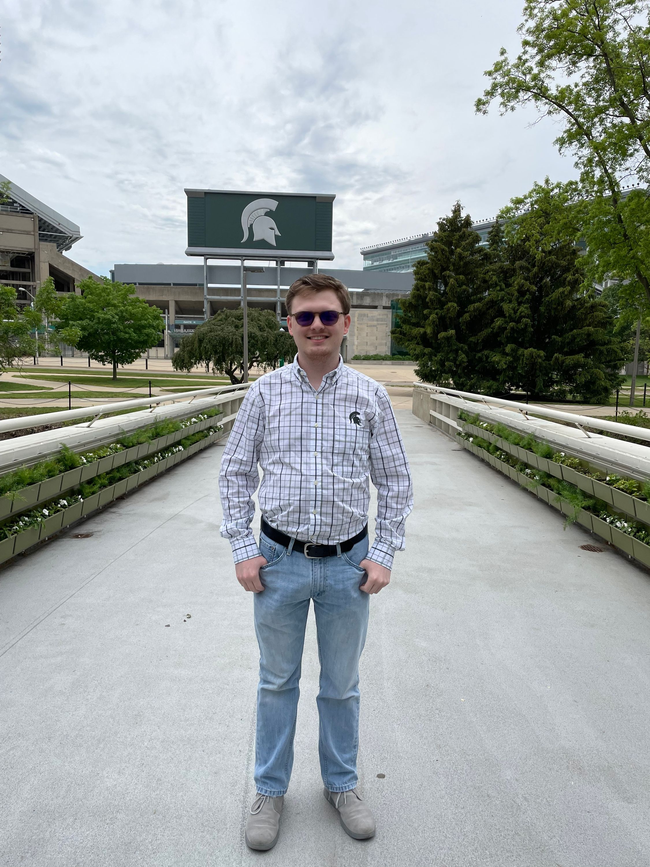 J.R. Nosal standing on the bridge near the green wall